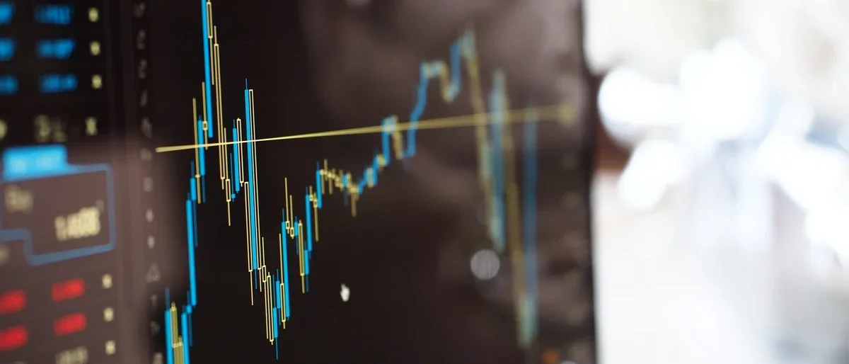 blue and yellow graph on stock market monitor