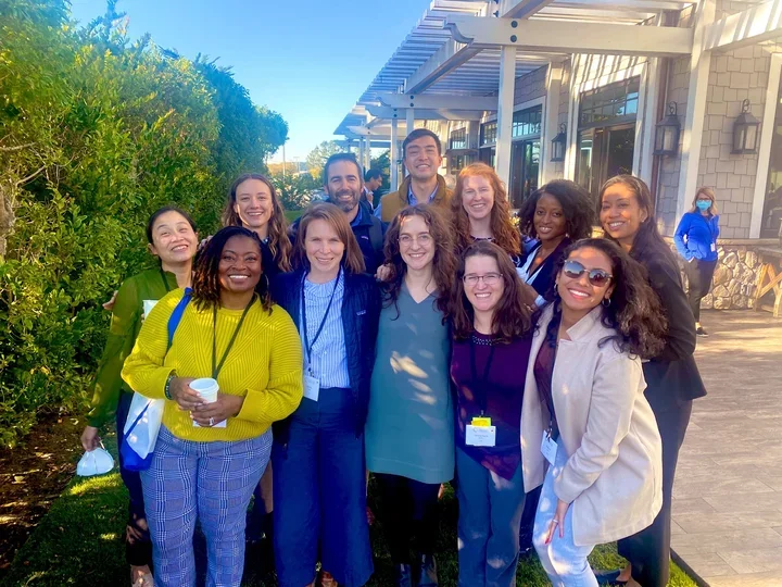 Group of smiling clinician scholars in Half Moon Bay, California.