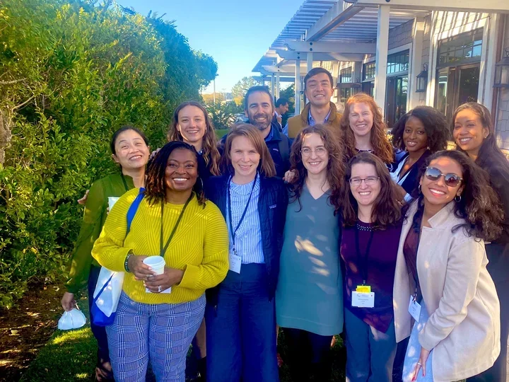 Group of smiling clinician scholars in Half Moon Bay, California.